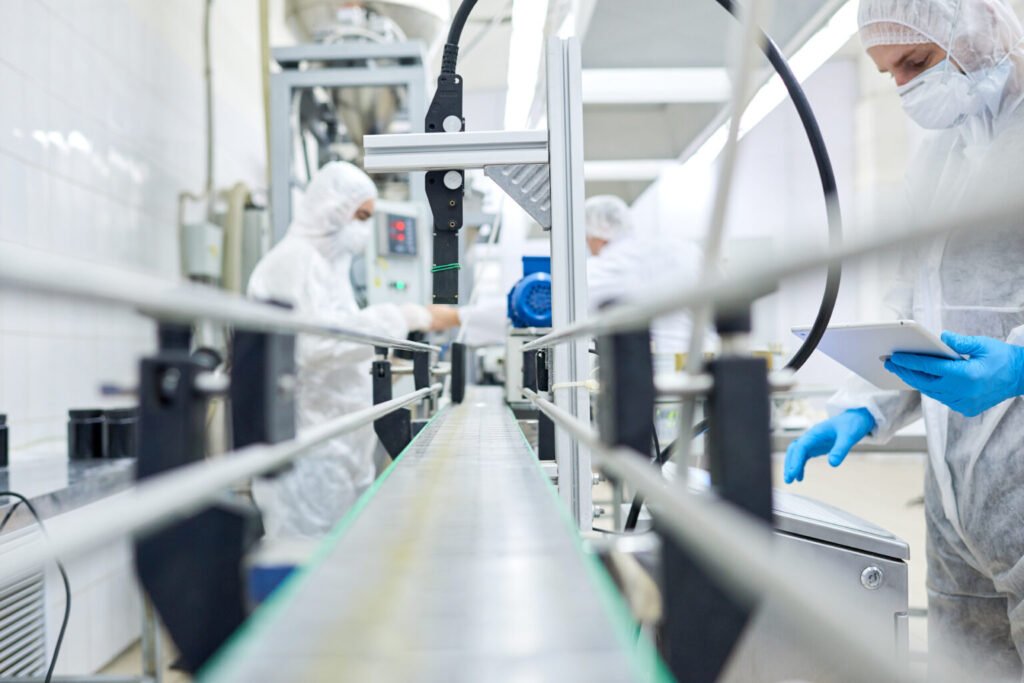 sports,nutrition,production,employees,working,in,protective,clothing,at,conveyor